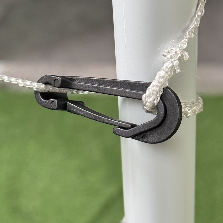 Close-up of net clip fastener on goal post